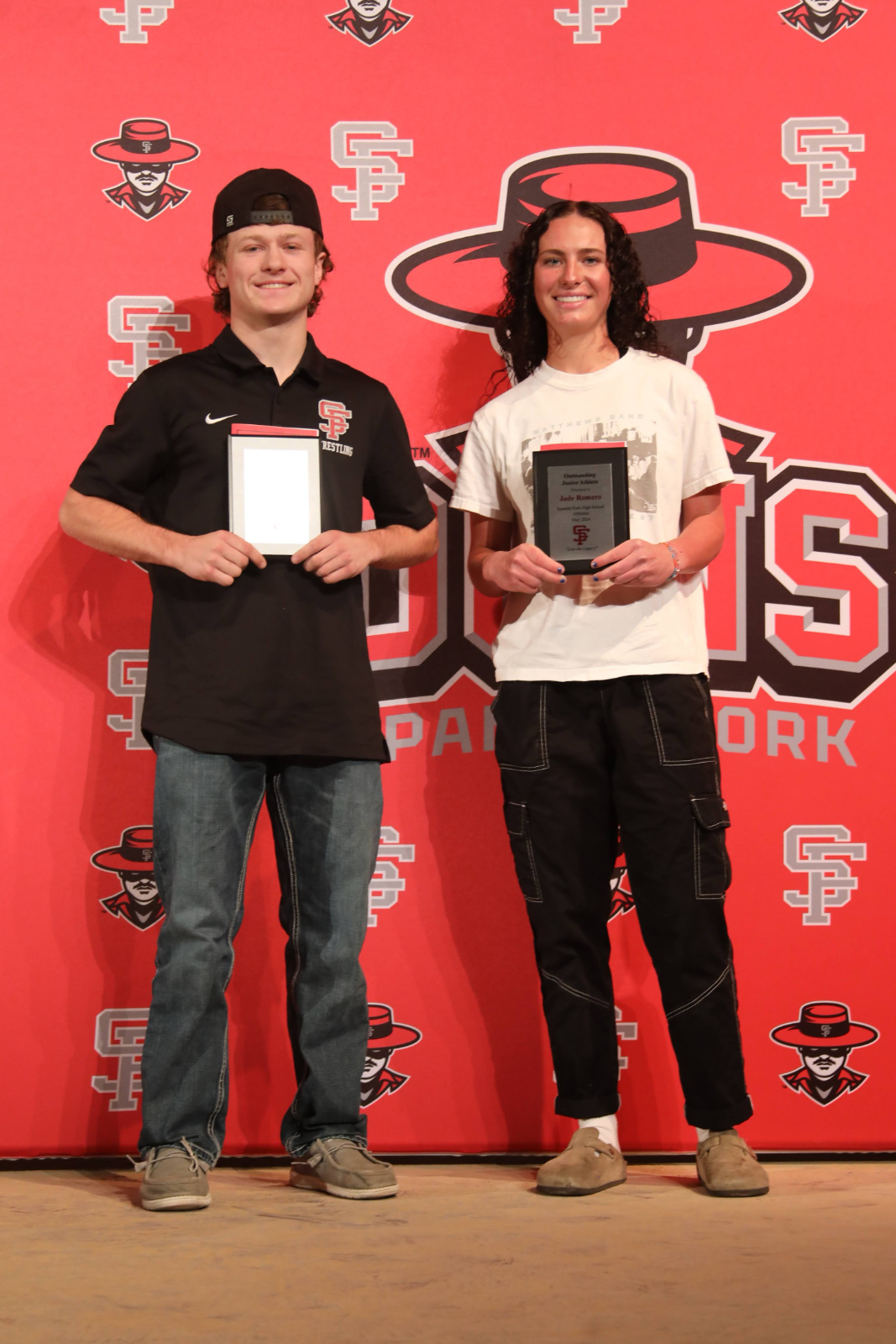 two students getting their award