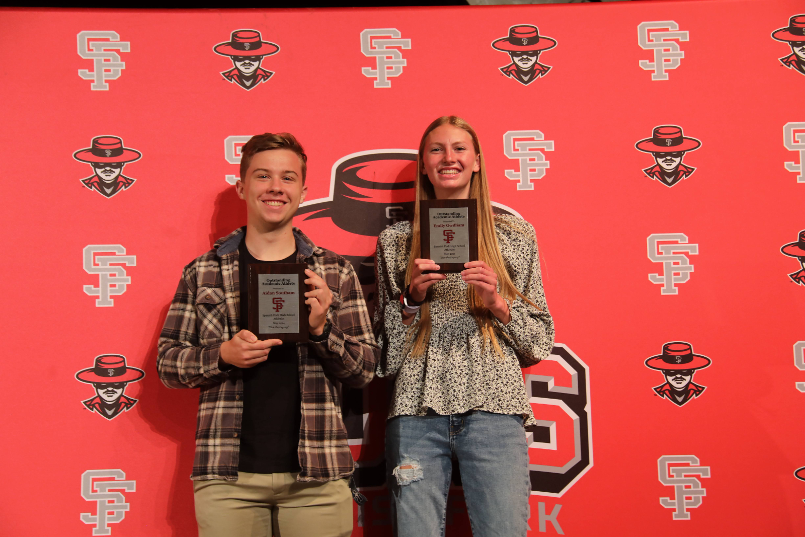 two students getting their award