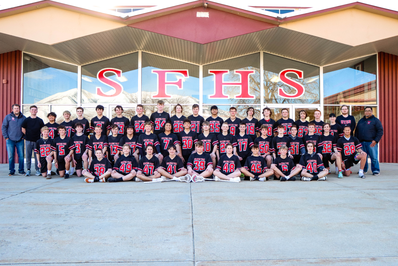 lacrosse team posing for a picture