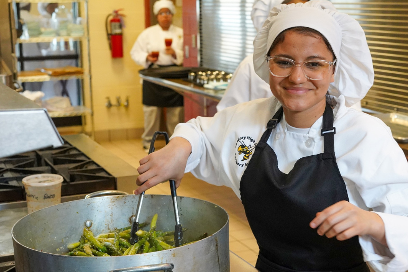 JEFCOED Culinary Arts student cooking asparagus. 