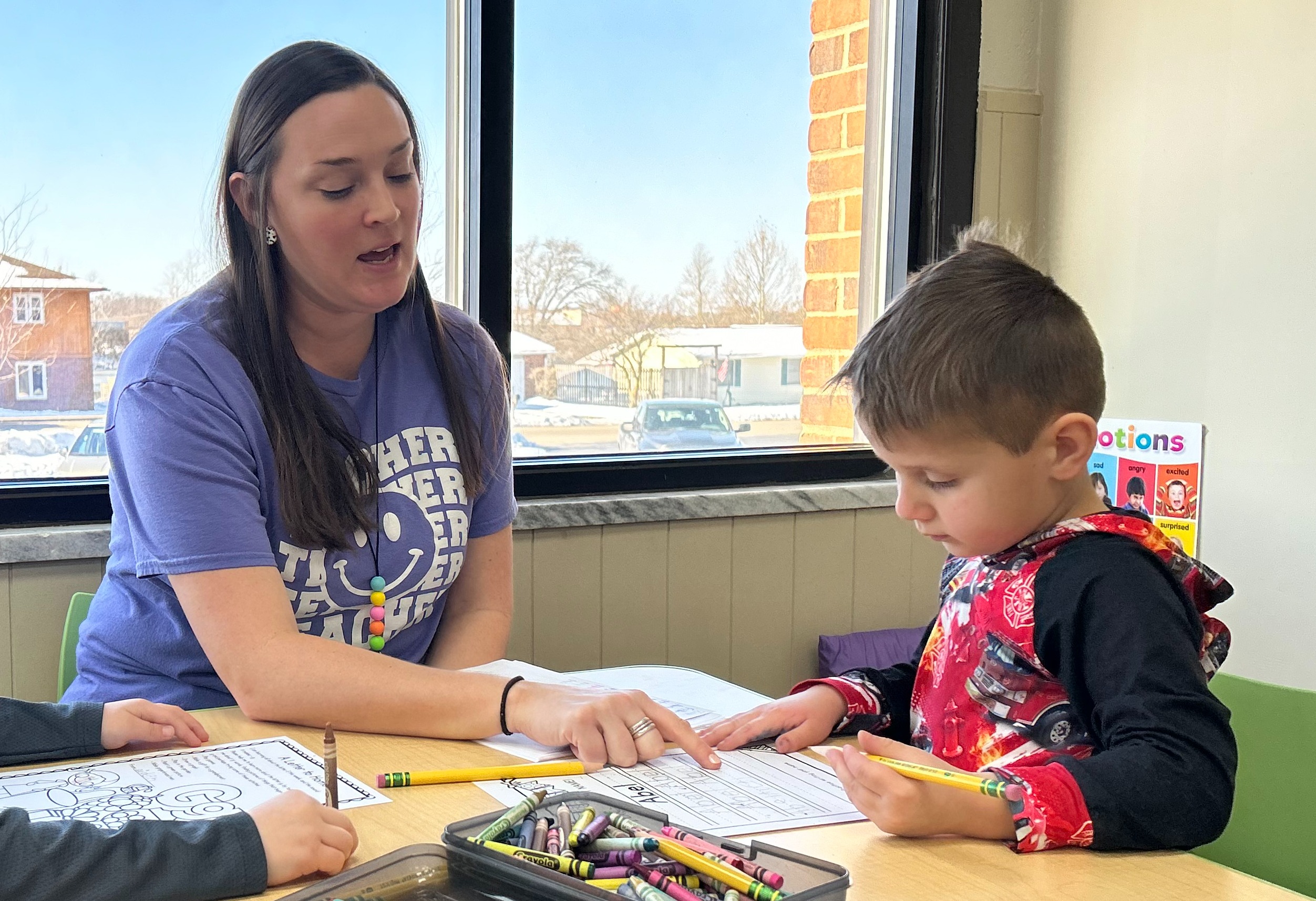 Teacher working with students
