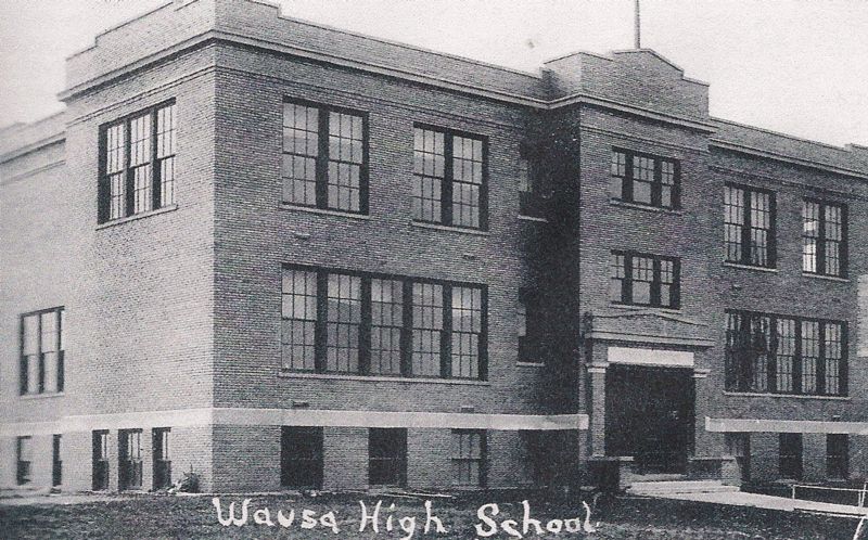 Vintage photo of high school building in black and white.