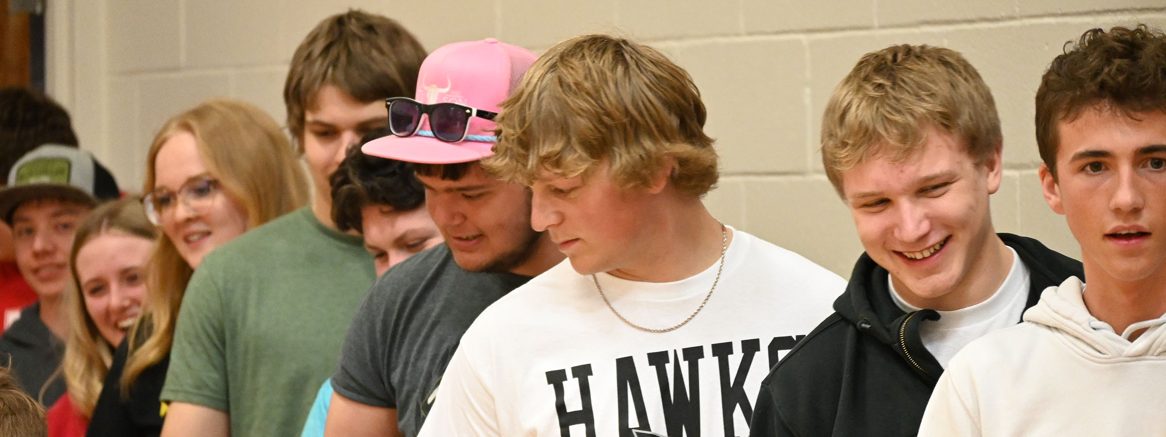 A row of young men standing together.