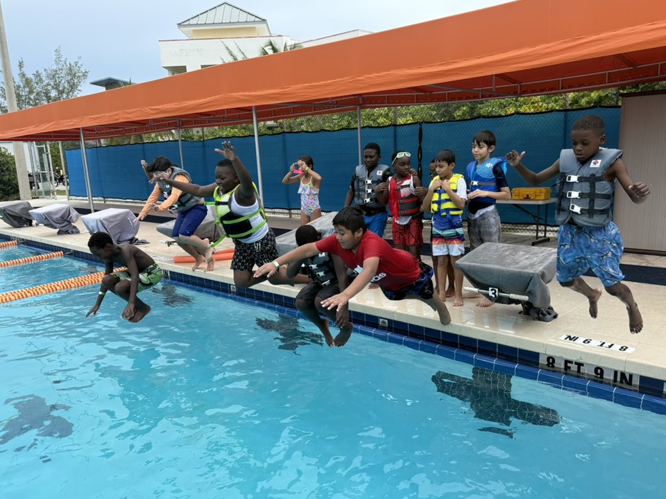 Kids jumping in a pool