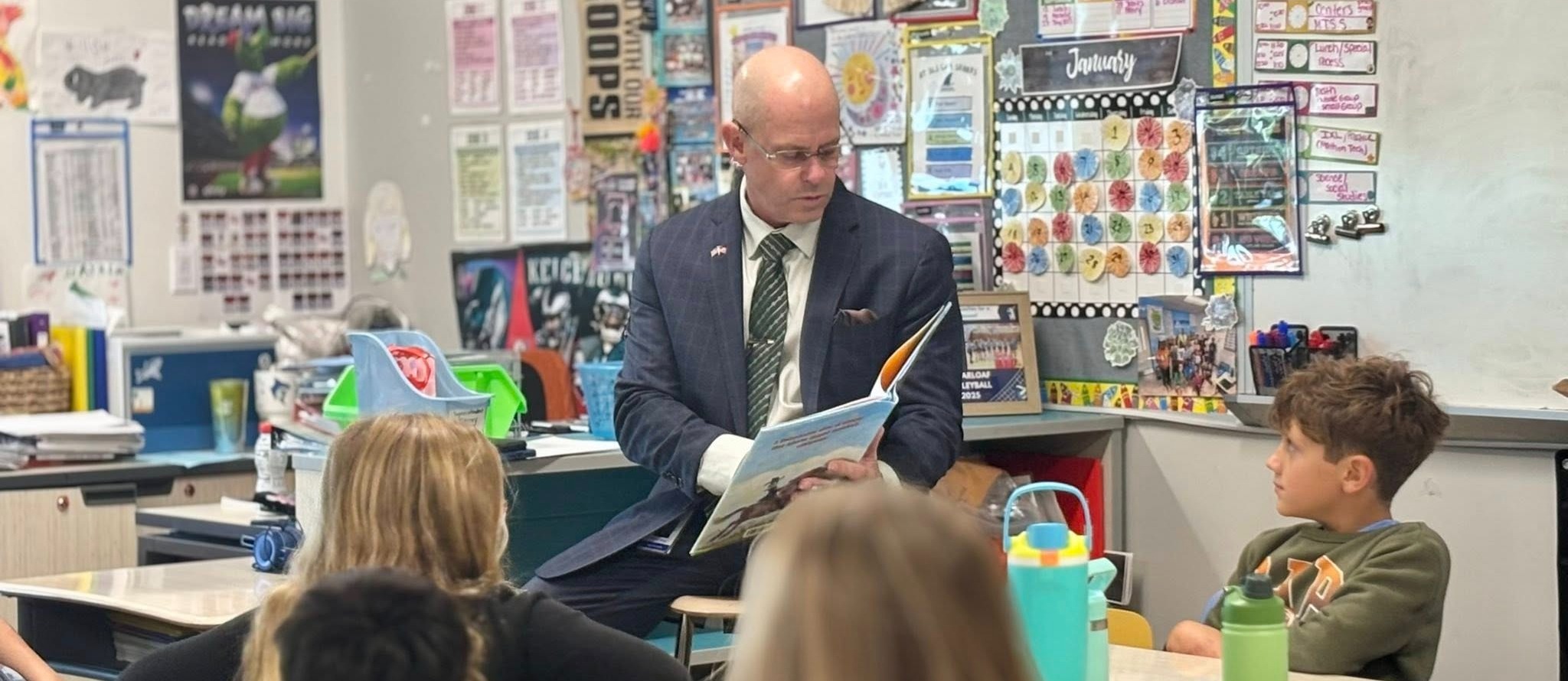 Superintendent reading to students