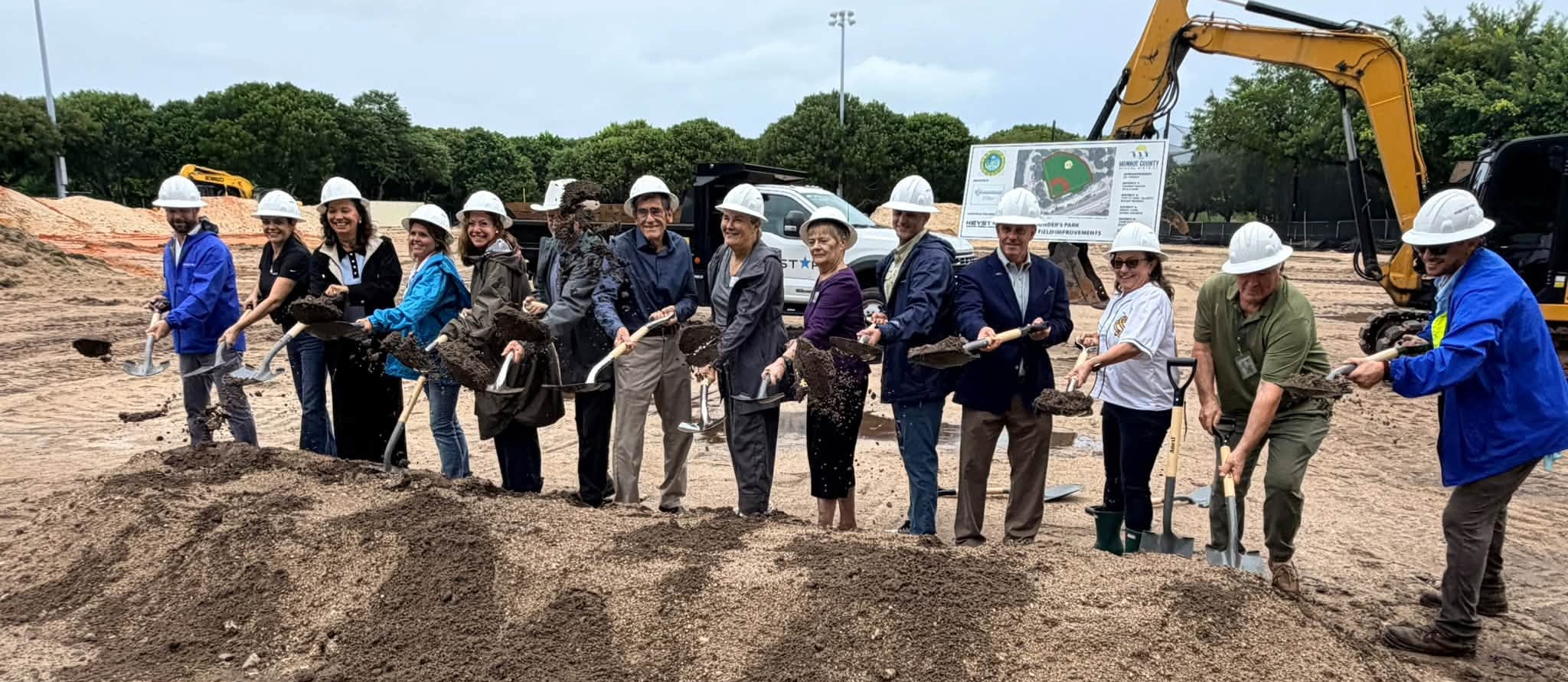 Groundbreaking at Founders Park. Group holding shovels.