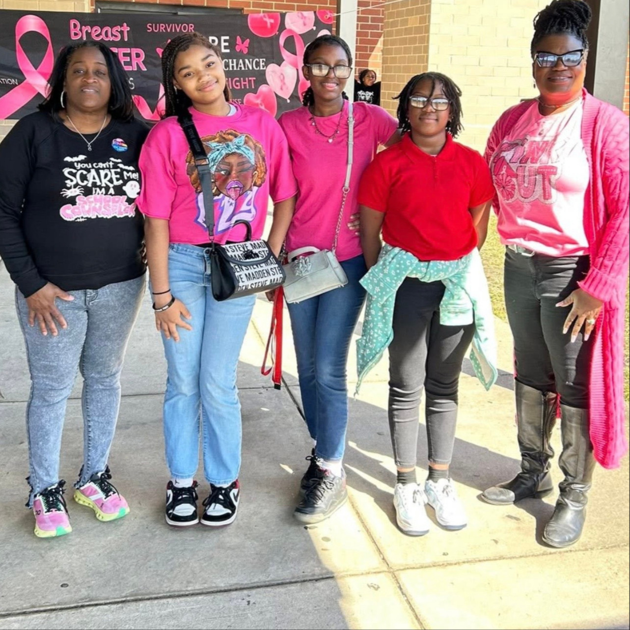 Teachers standing with a group of students.