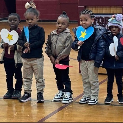 students standing in a the gym
