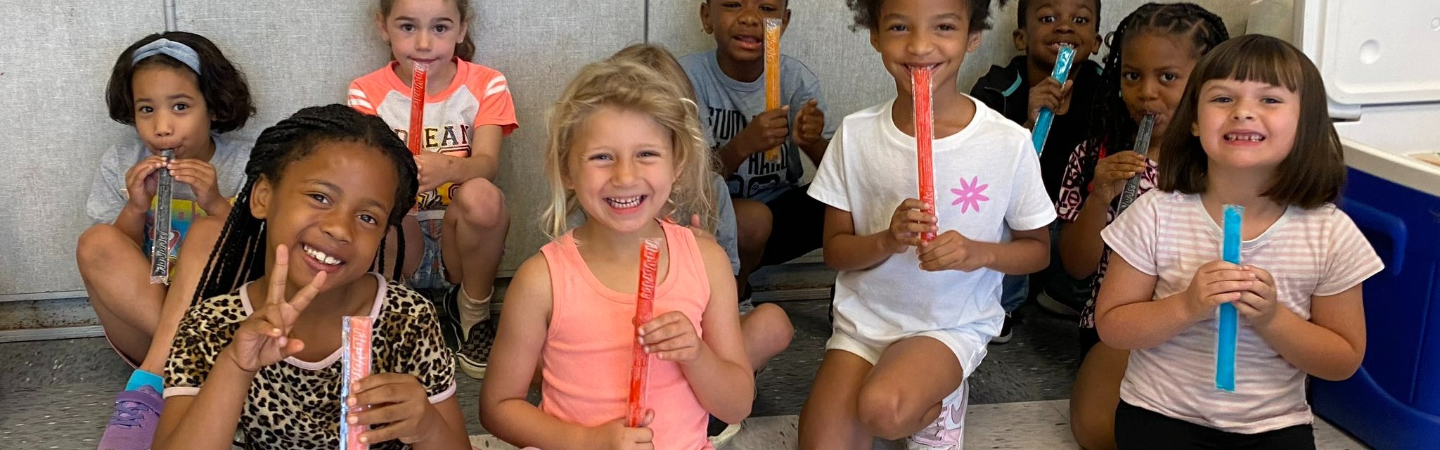 Students enjoying popsicles after Field Day