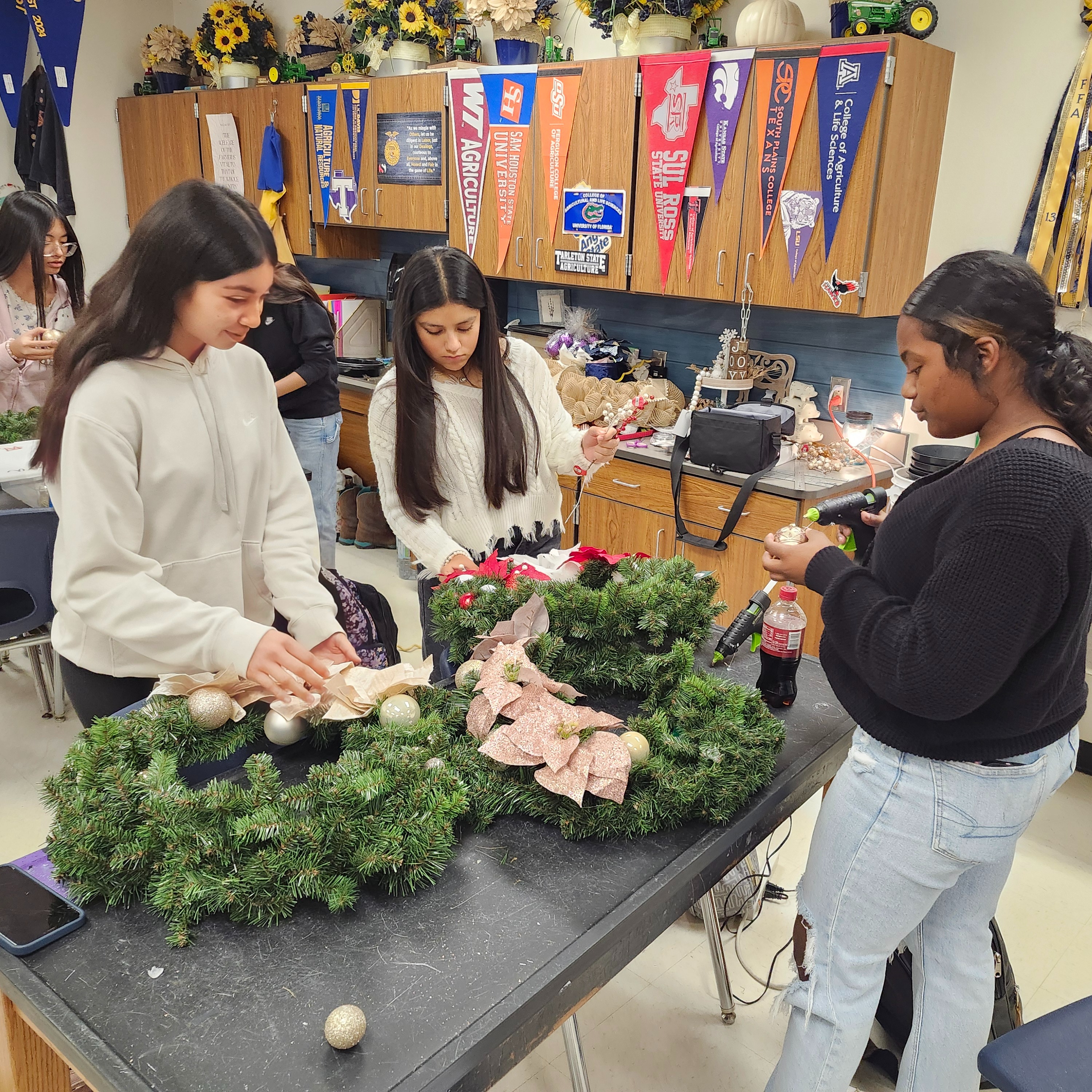 Students working on Christmas wreaths