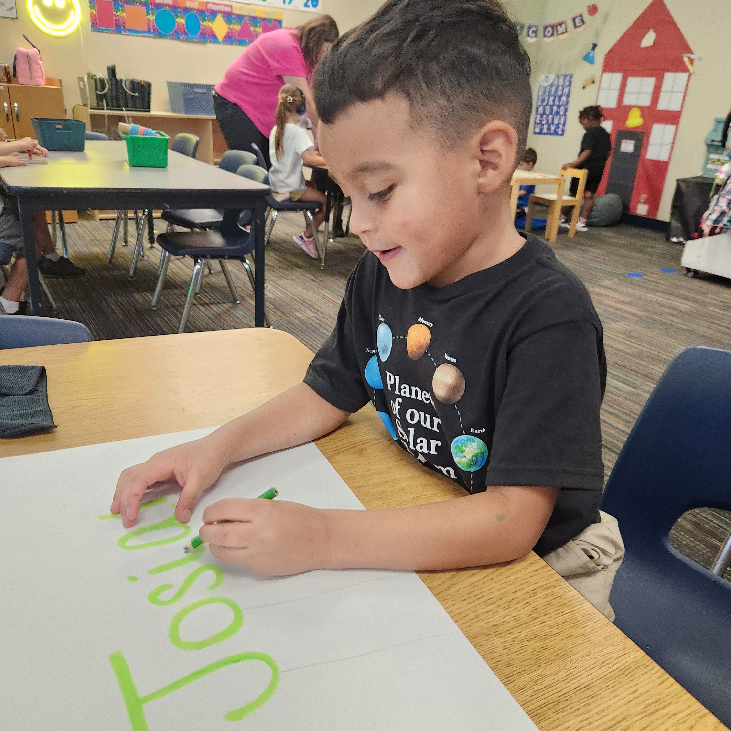 Child writting his name