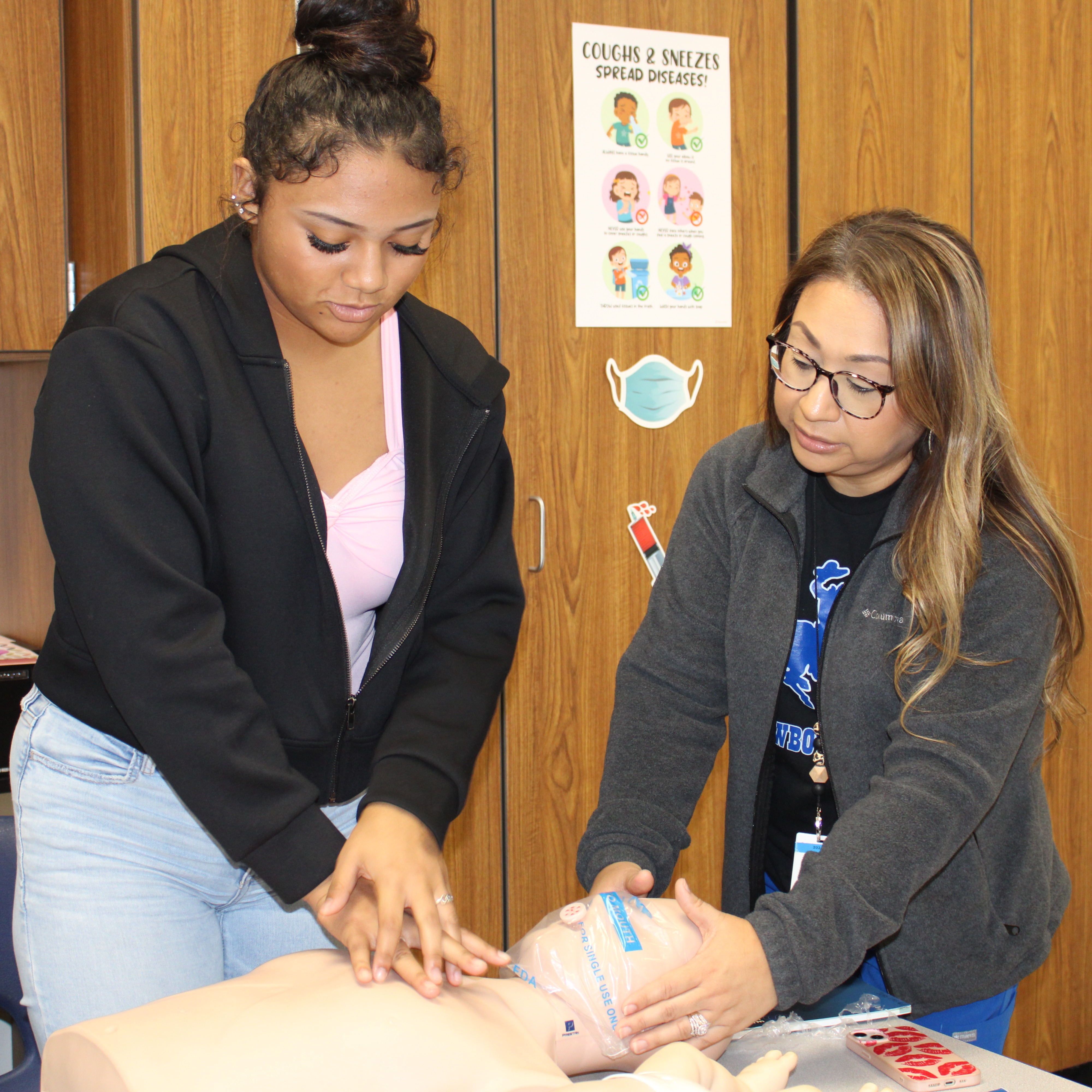 Nursing Student and Teacher with CPR Dummy