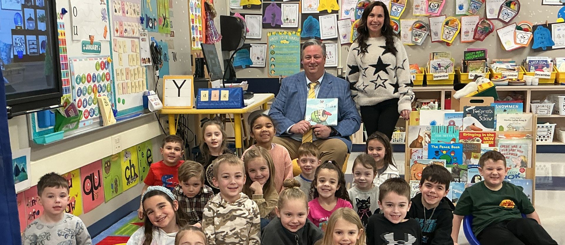 Dr. Brennan is a guest reader in Mrs. Sonzone's classrs