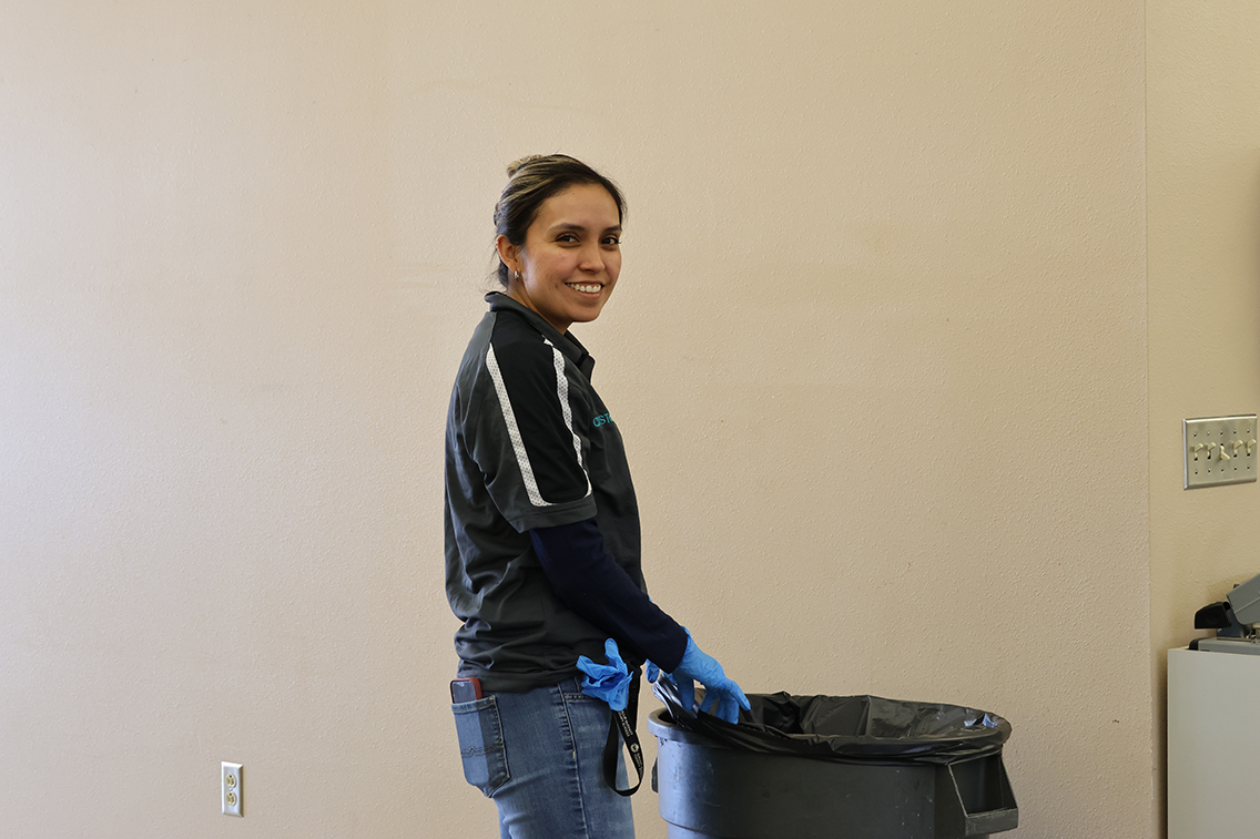 custodian with gloves on