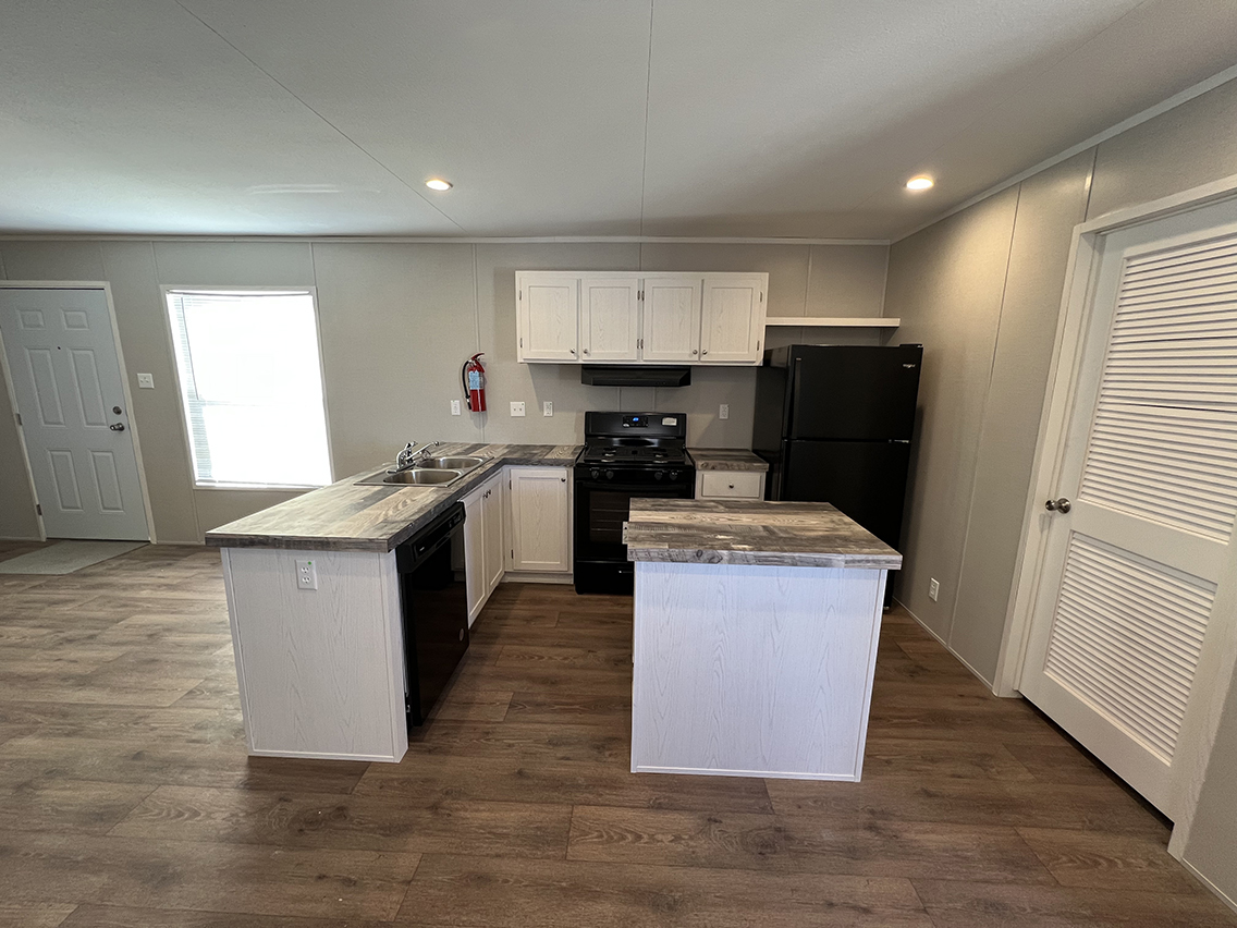 kitchen with island and refridgerator