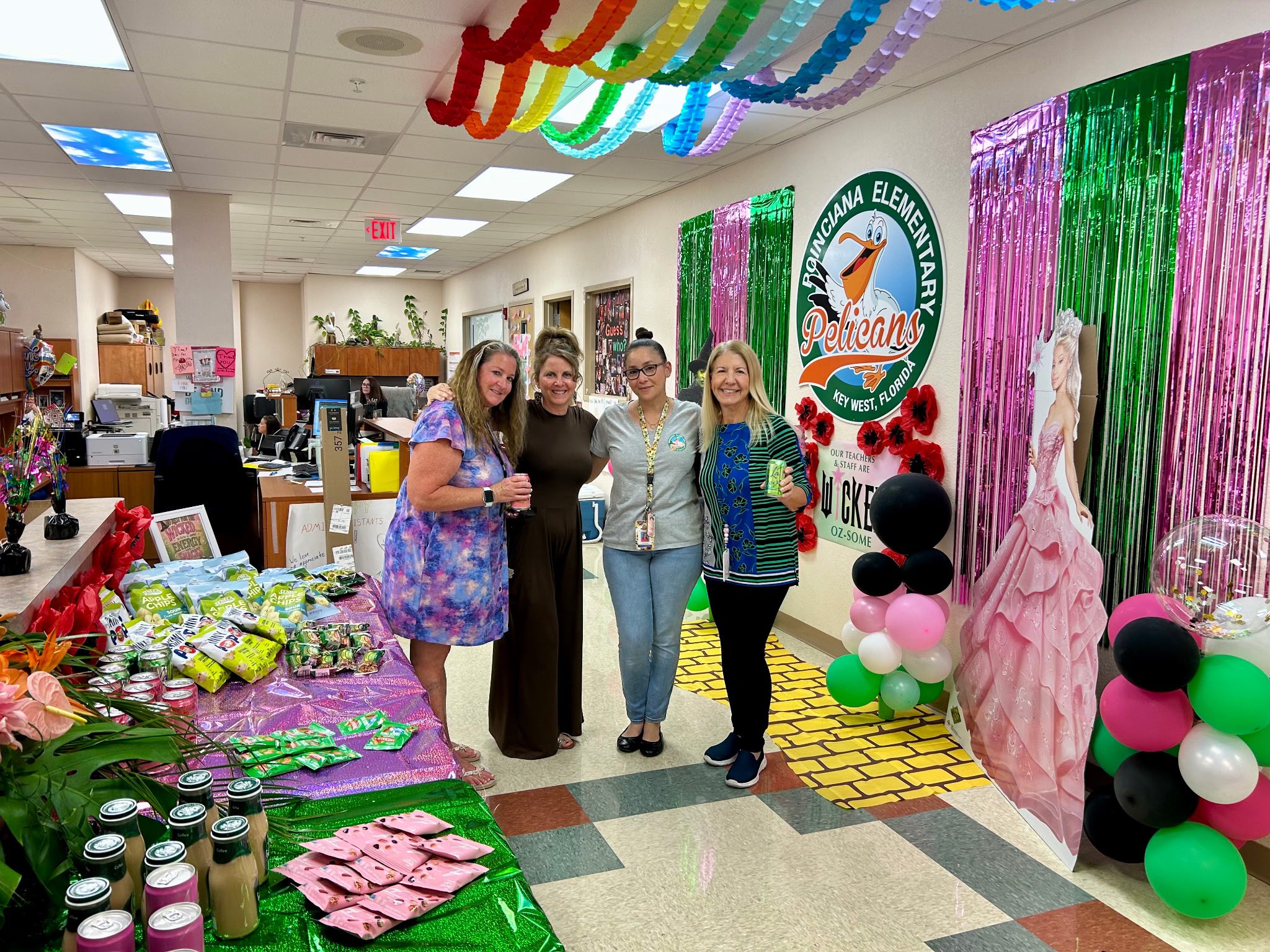 Teachers standing together in a decorated room