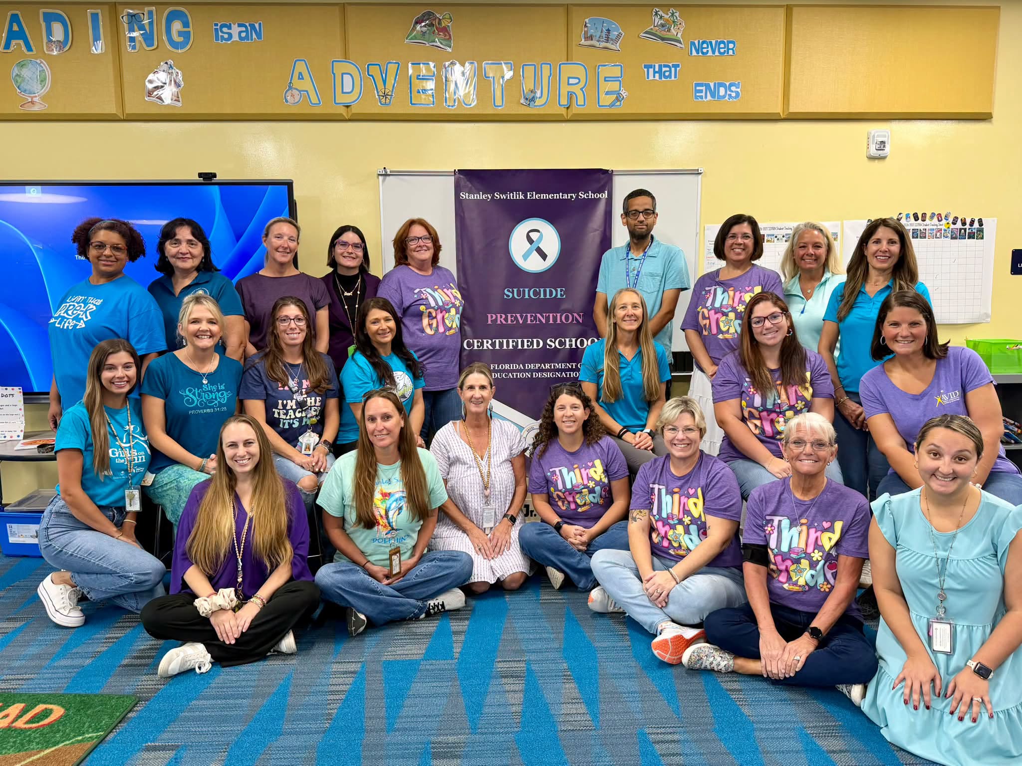 Staff wearing purple and teal for Suicide Prevention Day