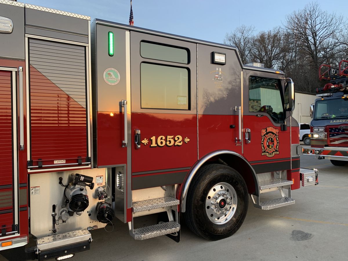 A red and black fire truck parked