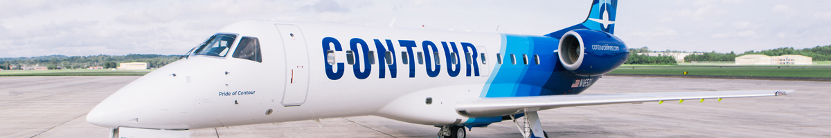 A blue and white airplane parked on the tarmac