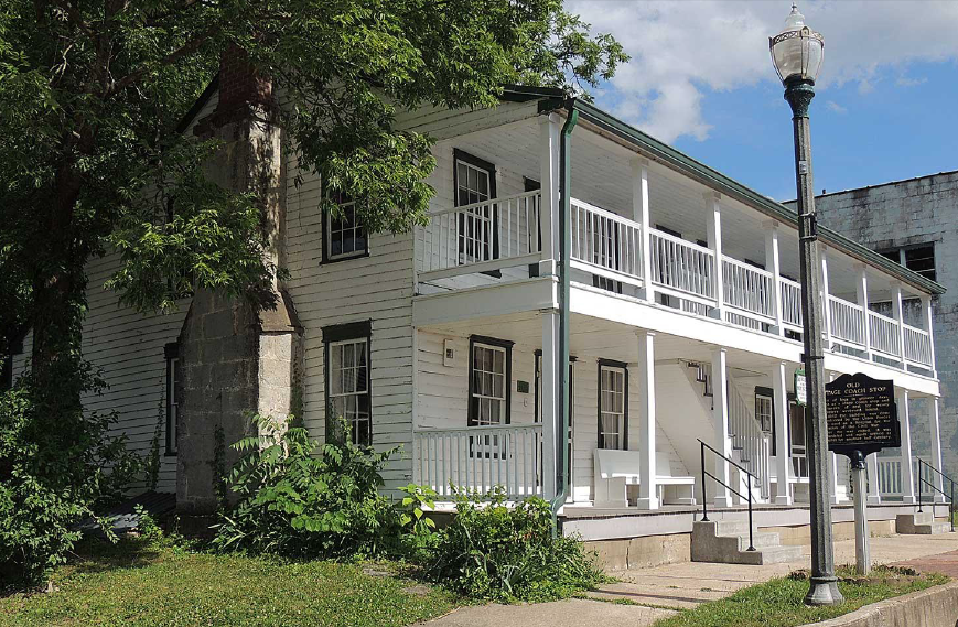 A white house featuring a balcony