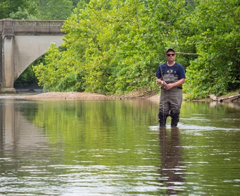 Trout fisherman fishing in the Roubidoux Creek. 