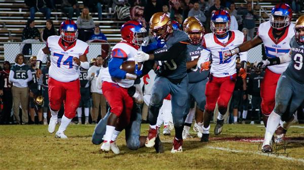 Football players in action on the field.