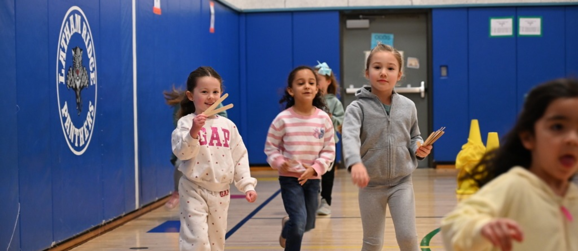 Three children running at latham ridges running club 