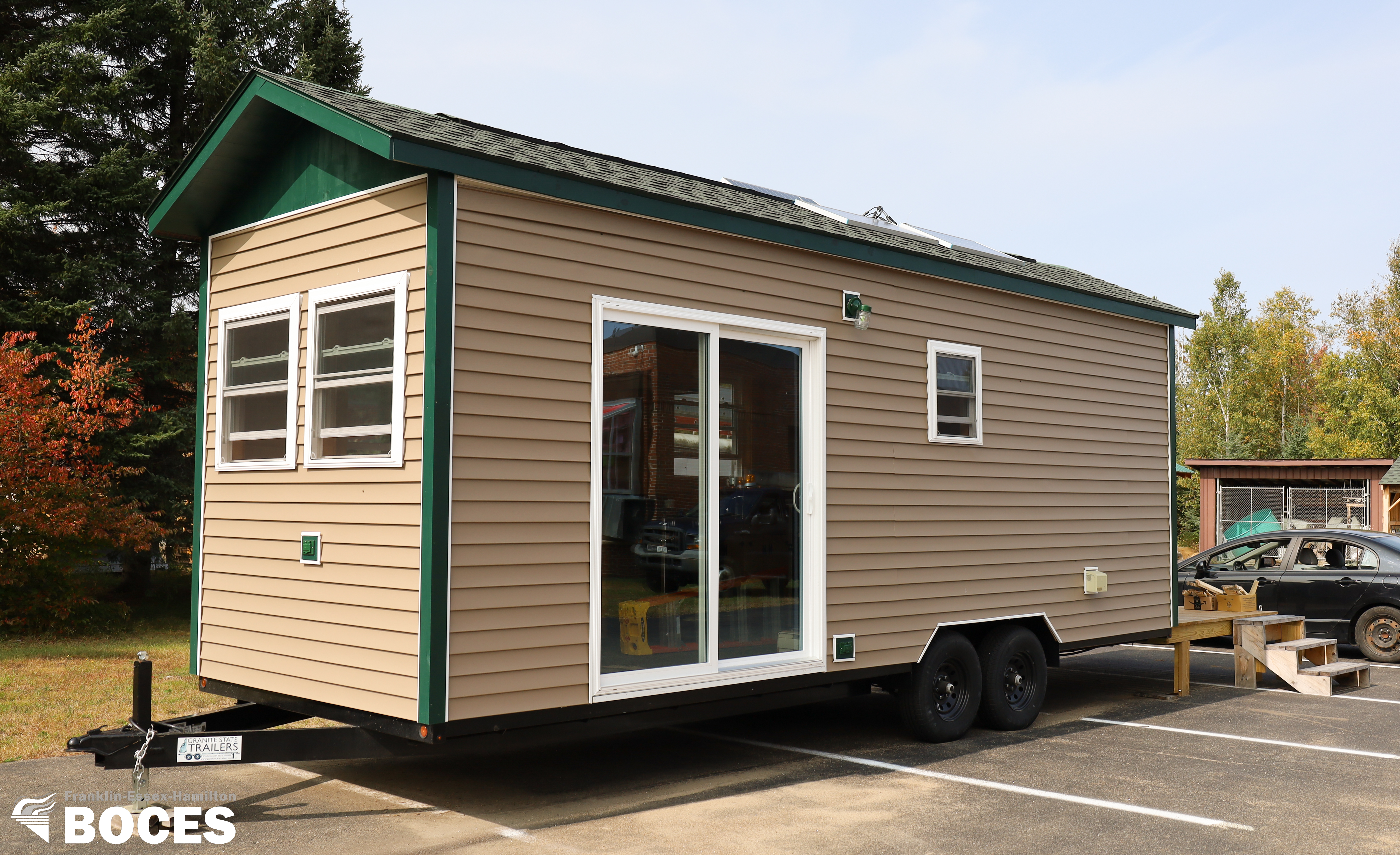 Photo of tiny house exterior from trailer hitch side