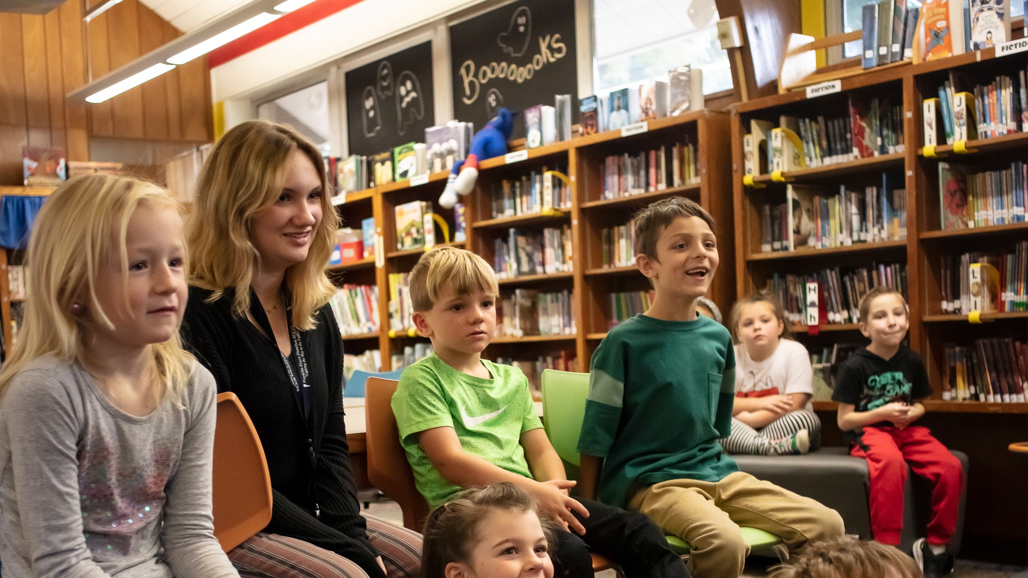 Students at listening to story in library