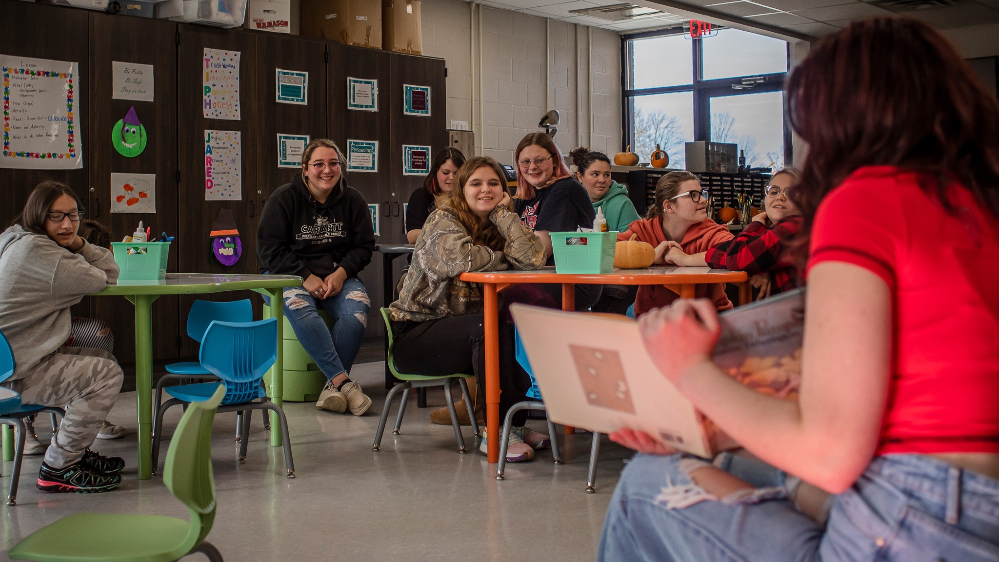 teacher showing a book