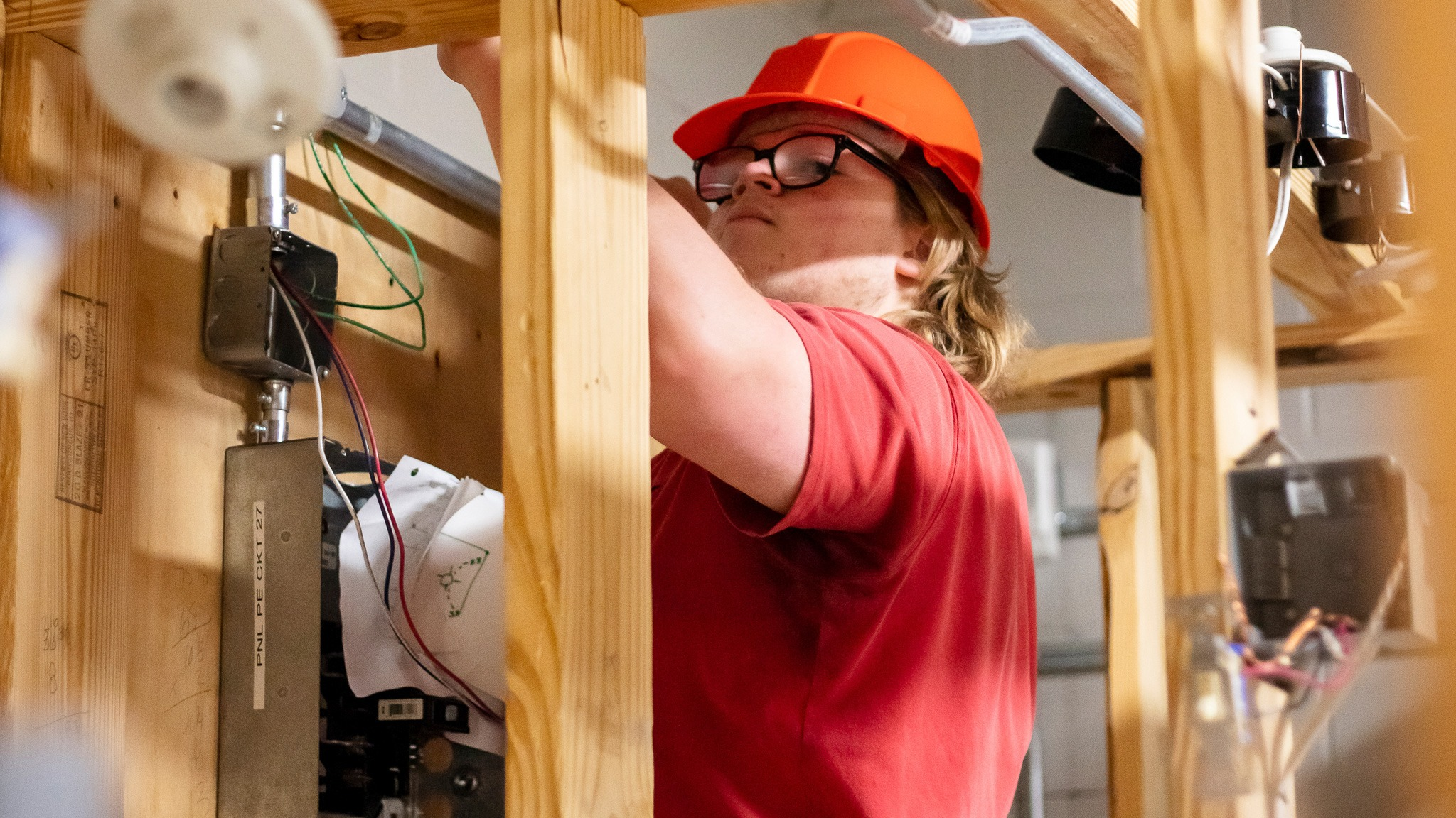 student examining wires