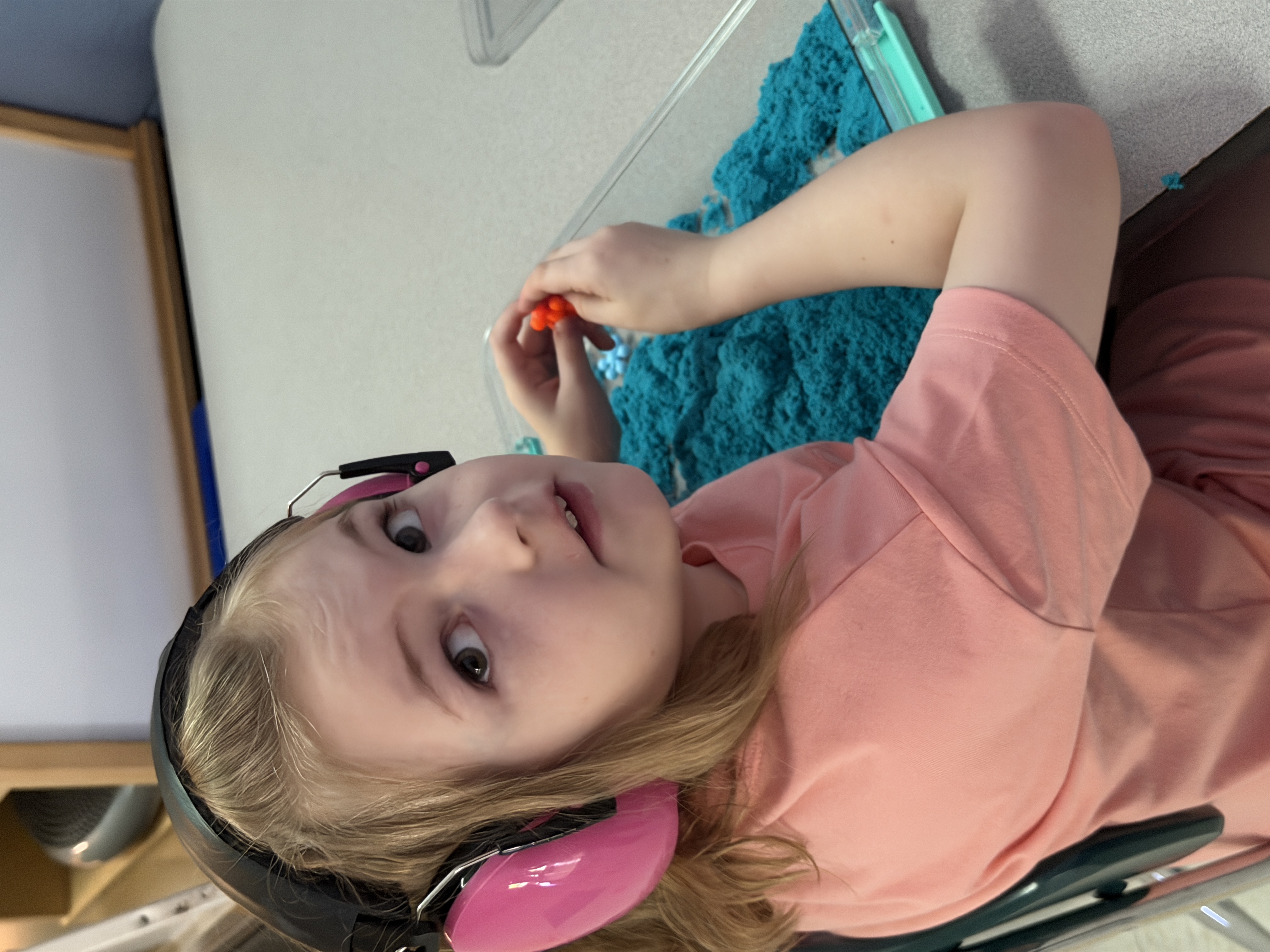 Picture of student working with kinetic sand.