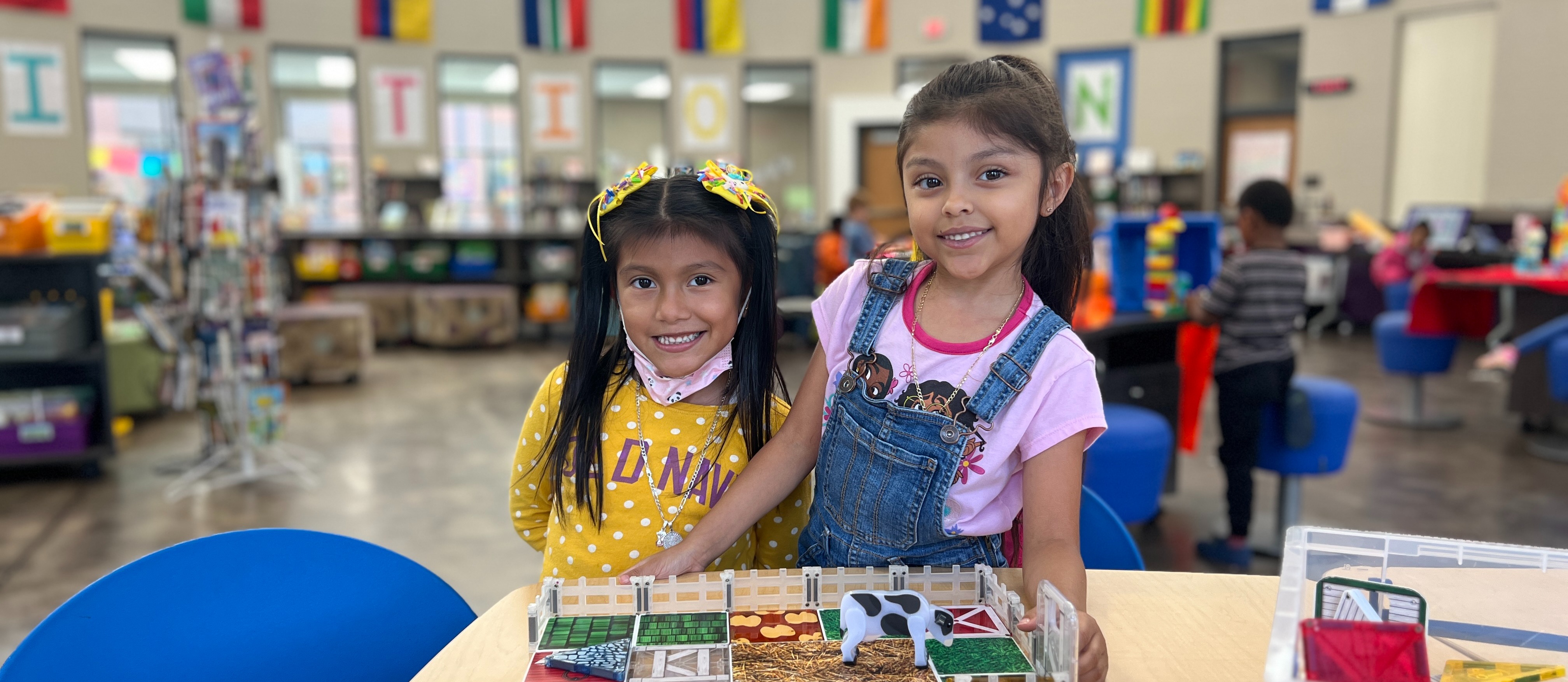 two girls in library centers