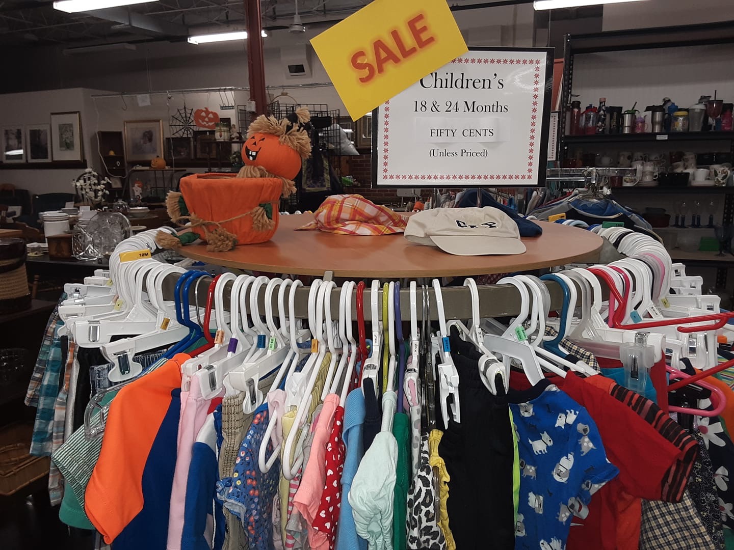 A photo of clothes on a rack in the LSA Resale Shop