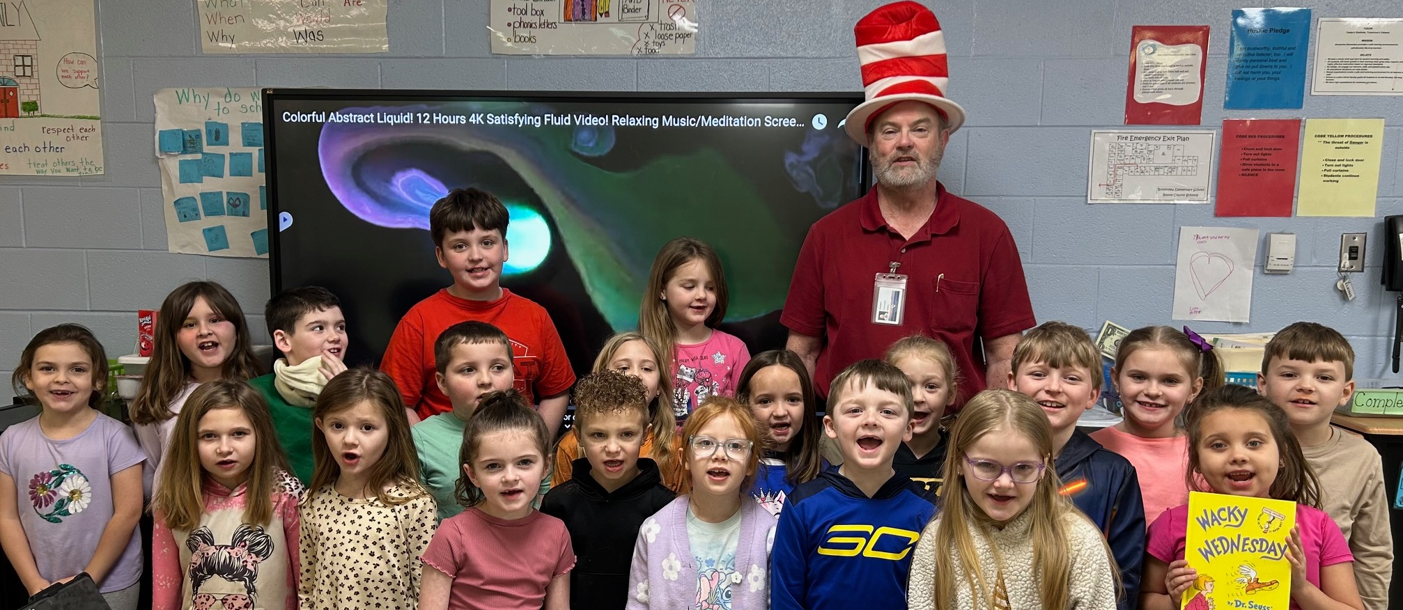 students standing with guest reader