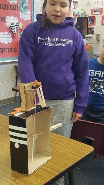 Photo of a student working on a Cardboard Automatas