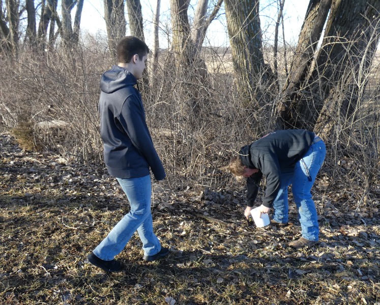 Students gathering soil for their experiment