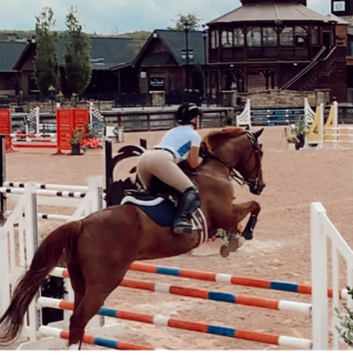 student riding a horse
