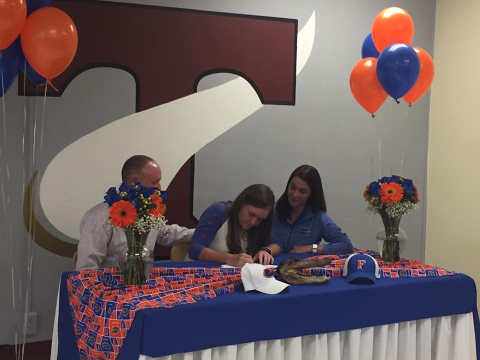 student signing a contract