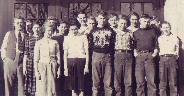 Students traditionally pose in front of the “Learning is Life” sign over the school’s front door.