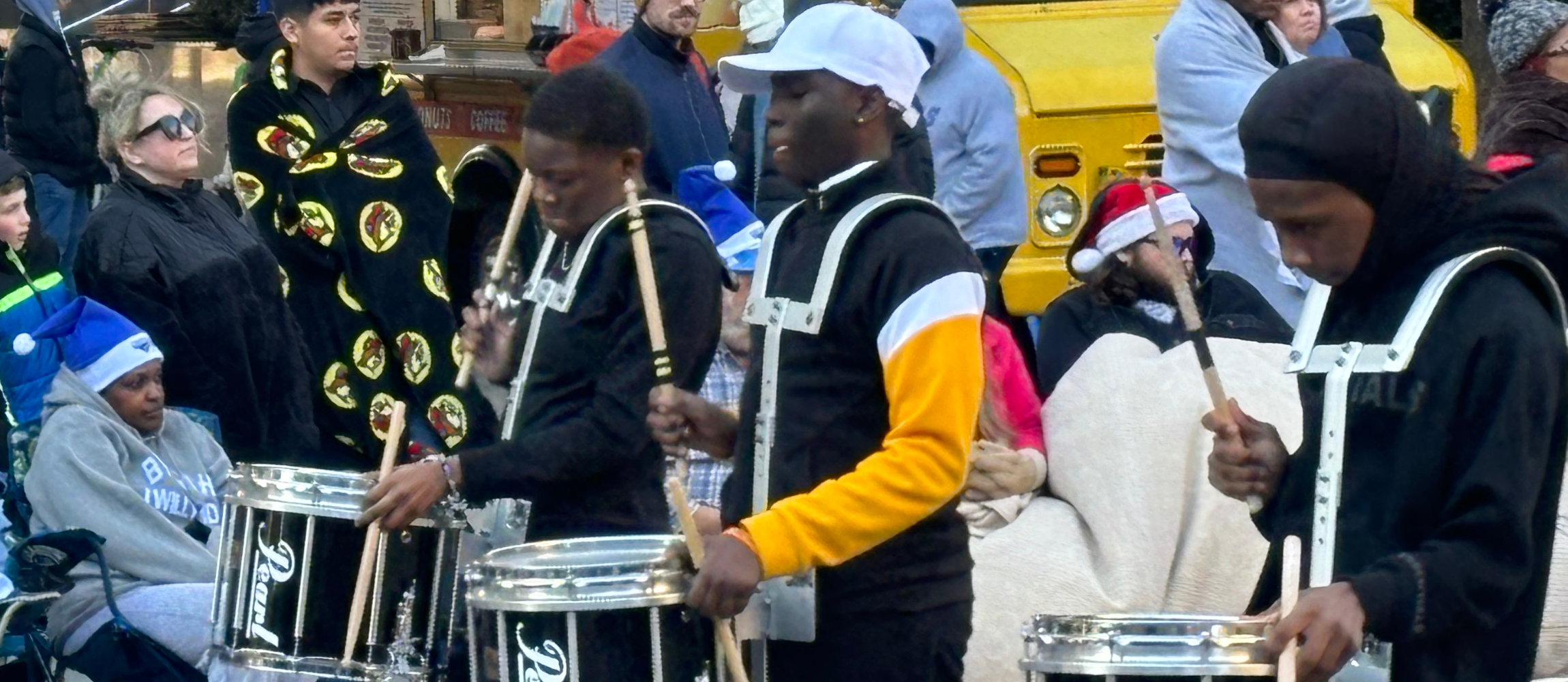 3 LGMS students in the drumline playing in the Raleigh holiday parade