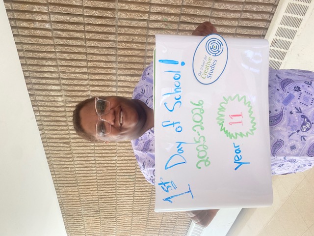 teacher holding sign showing how many years at the district