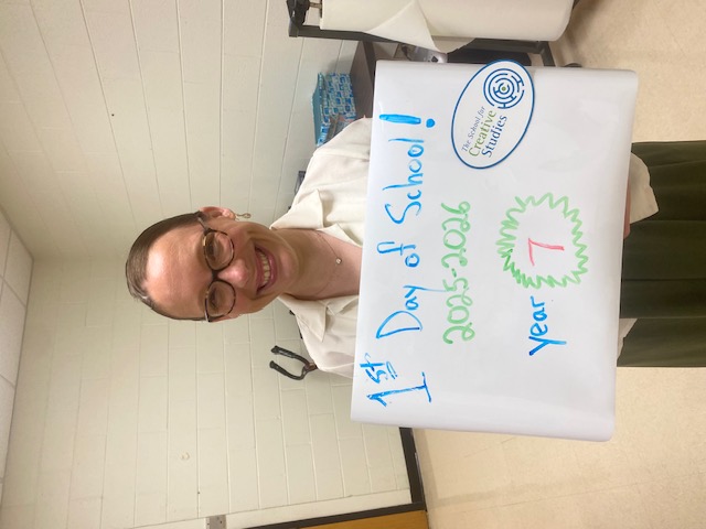 teacher holding sign showing how many years at the district