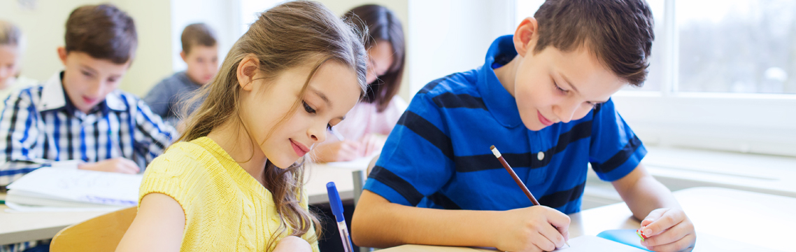 Children taking notes