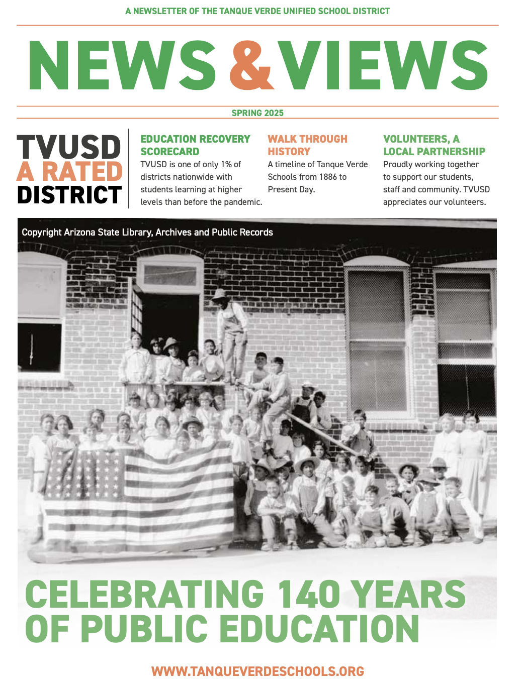 A black-and-white image features a group of children holding an American flag, set against a backdrop of a school building.