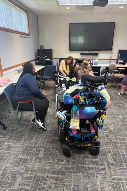 Dr. Shacorrah Evans, Shasta McCullough and student in Wheelchair