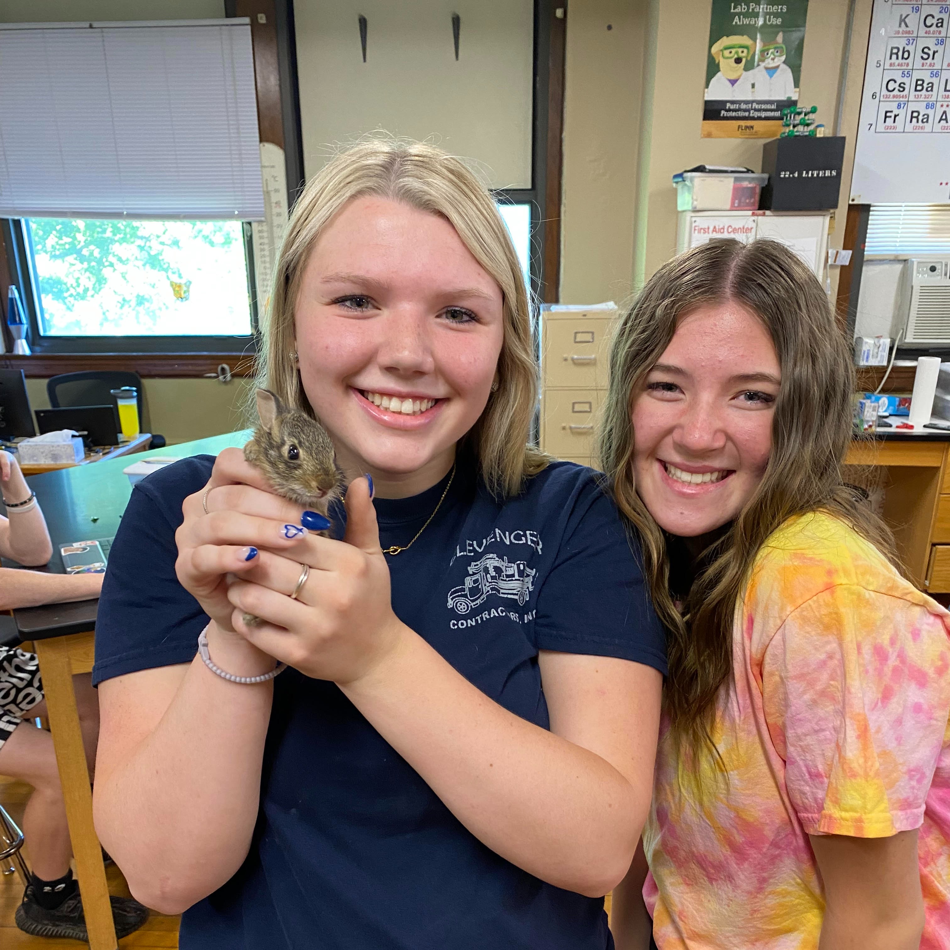 Keira holding a bunny; with Mariah