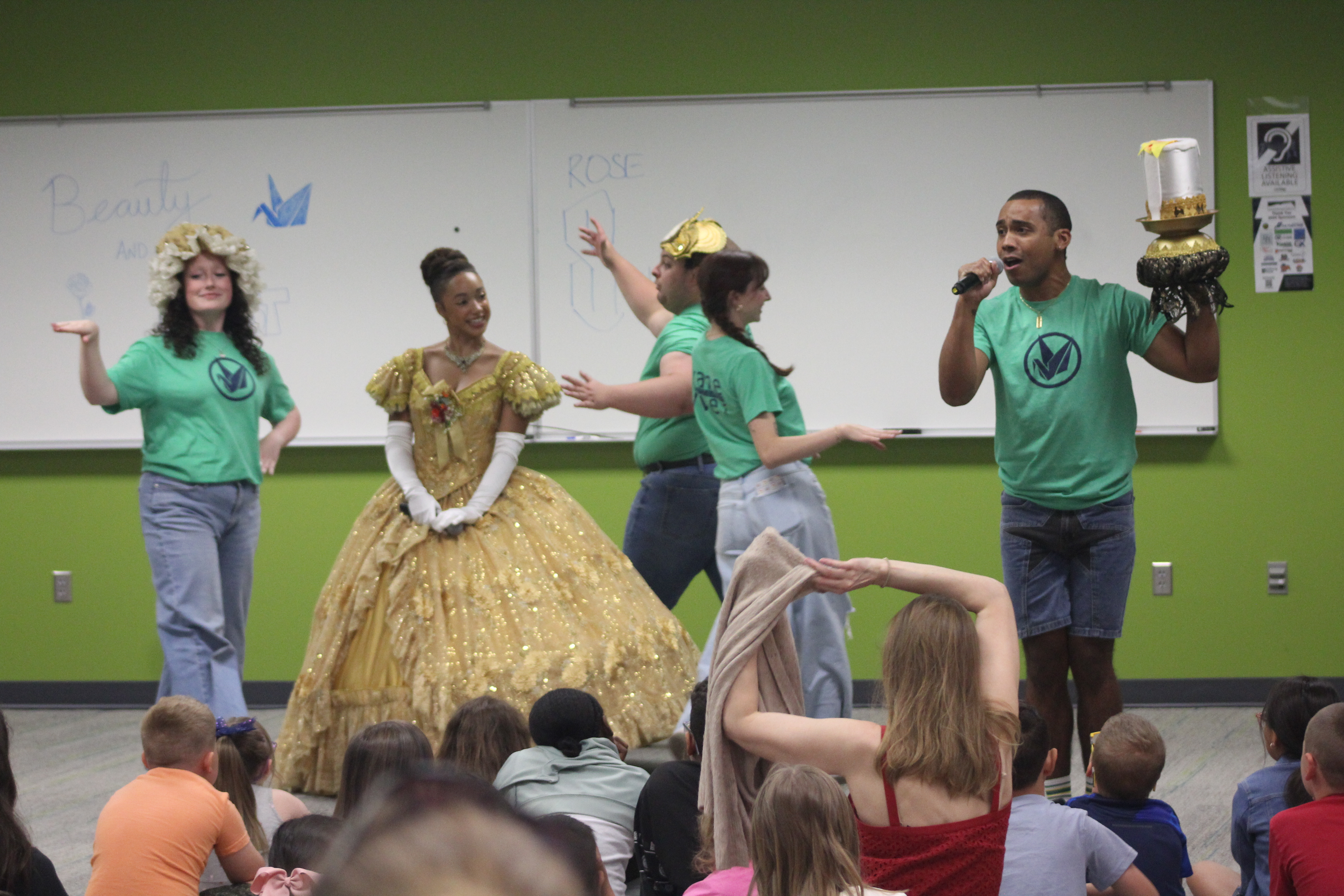 Actors from the Crane River Theater present excerpts from "Beauty and the Beast" to a large group of children