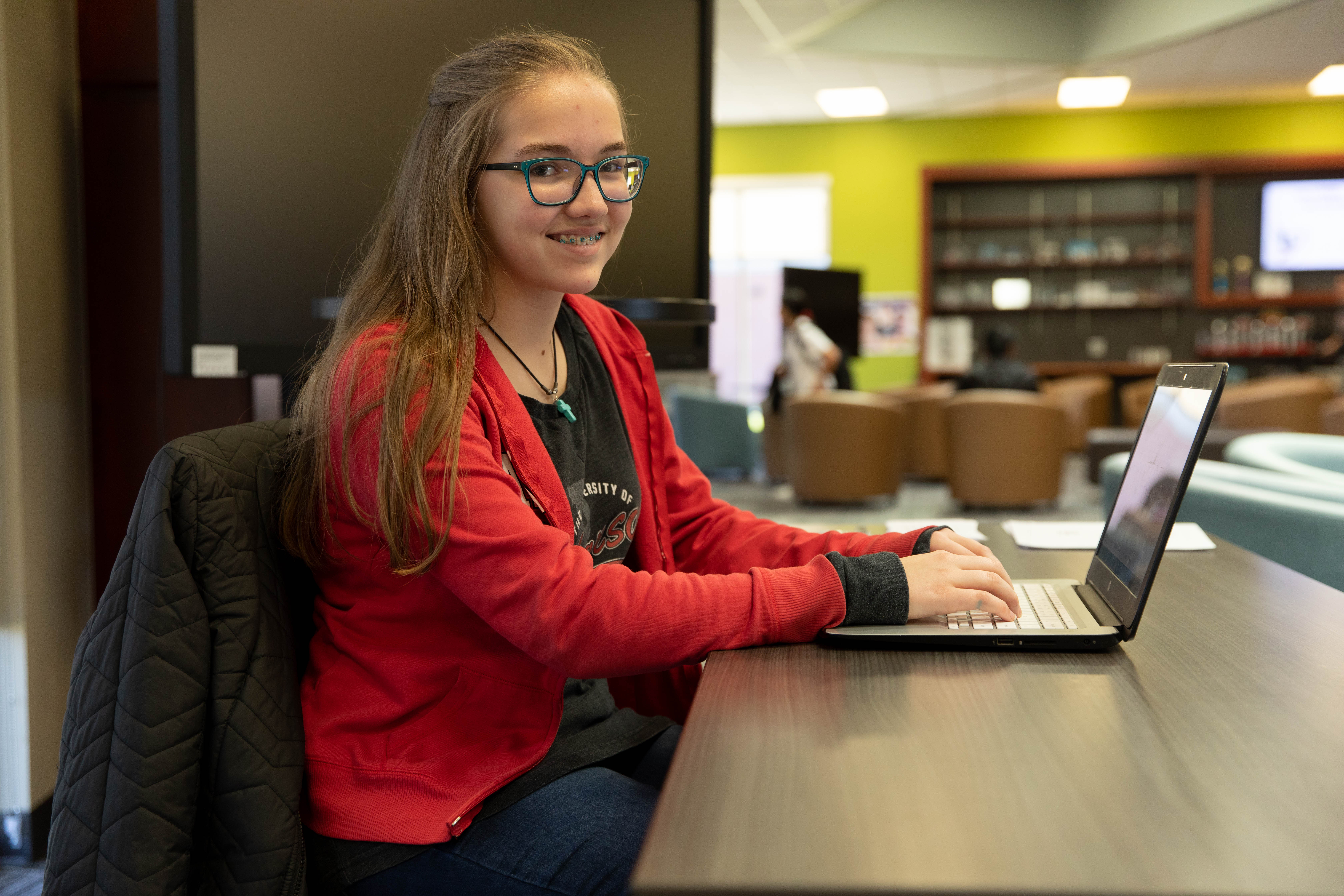 Photo of a student with her laptop.