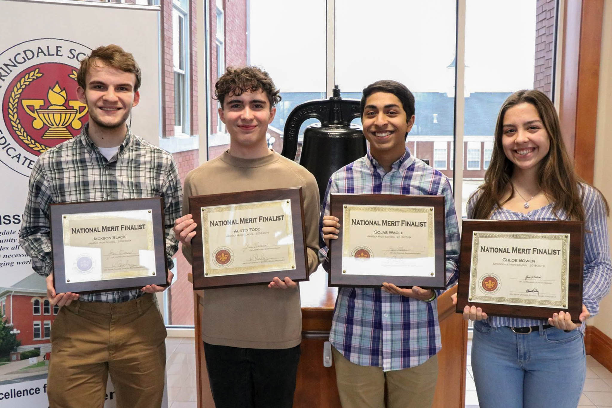 Photo of some students with their diplomas.